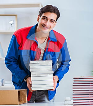 Worker in publishing house preparing book order