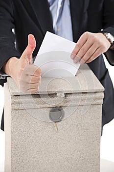 Worker putting letter in mailbox,showing thumbs up gesture