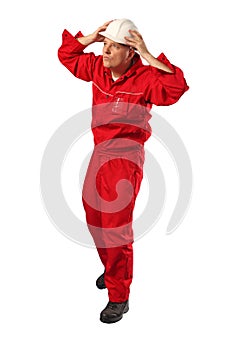 Worker in red uniform wearing white hardhat photo