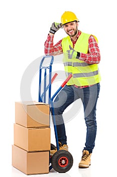 Worker in reflective clothes showing thumb up