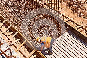 Worker on reinforcement work at construction site