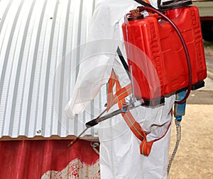 Worker during the remediation of asbestos from the roof