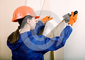 Worker removes old wallpaper