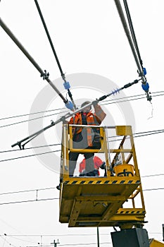 Worker repair the catenary