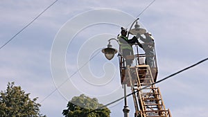 worker repair, during installation, metal pole,