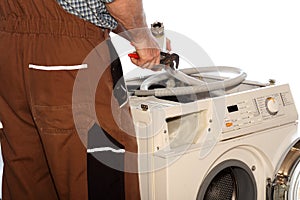 Worker is repairing a clothes washer