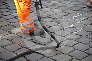 Worker repairing street