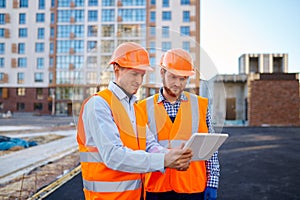 Worker reporting to contractor at construction site