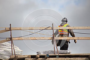 Worker on roof construction site building industry