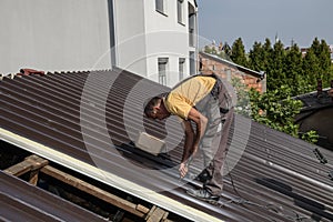 Worker roofer builder working on roof structure