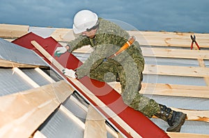 Worker at roofing works