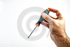 worker`s hand with screwdriver in hand photo