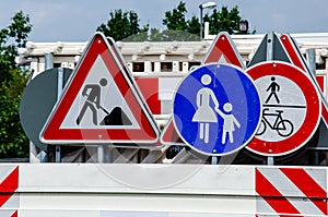 A worker`s truck with roadsigns at a road construction site