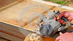 Worker Sawing Wood