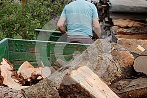 Worker saws wood