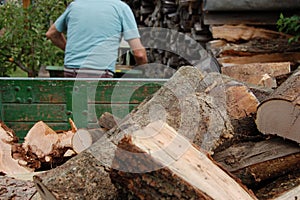 Worker saws wood