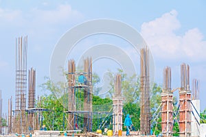 Worker on scaffold in construction site