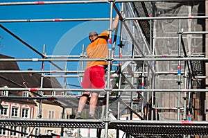 Worker on scafold