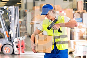 Worker scans package in warehouse of forwarding