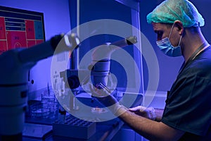 Worker of scientist laboratory preparing sample to examine