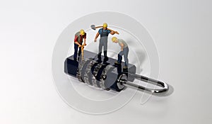 Worker and security key using as background security system, hack, business concept.