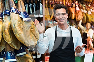 Worker selling Spanish jamon