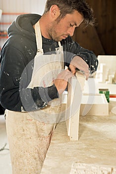 Worker Separating Plaster Model from Mold photo