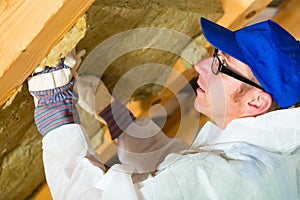 Worker setting thermal insulating material photo