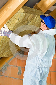Worker setting thermal insulating material photo