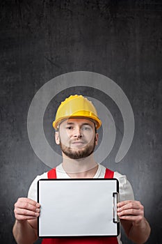 Worker showing a blank clipboard