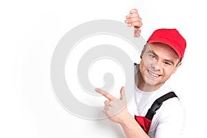 Worker showing blank sign and smiling.