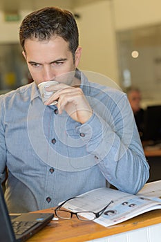 Worker sipping beverage during breaktime