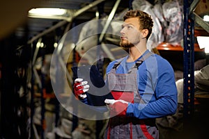 Worker in a spare parts warehouse