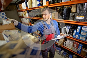 Worker in a spare parts warehouse