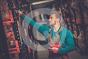 Worker in a spare parts warehouse