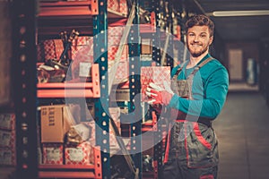 Worker in a spare parts warehouse