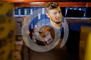 Worker in a spare parts warehouse