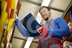 Worker in a spare parts warehouse