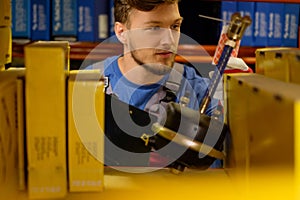 Worker in a spare parts warehouse