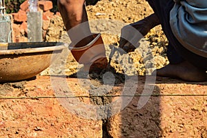 Applying Mortar on Brick Wall with Hand Tool