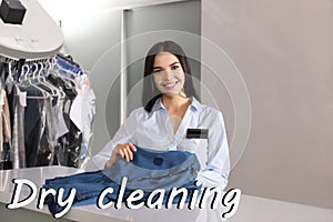 Worker with stained clothes at dry-cleaner`s