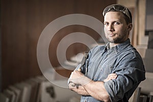 Worker standing with a chisel