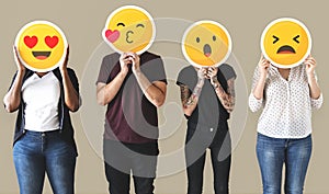Worker standing and holding face emojis photo