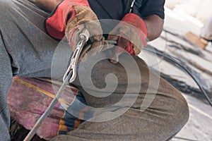 The worker straightens rebar