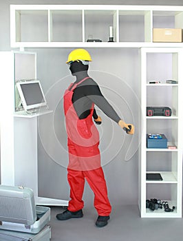 Worker stretching arms in the industrial environment.