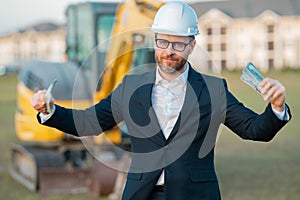 Worker in suit and helmet. Investor civil engineer, construction manager. Construction building developer at a