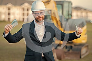 Worker in suit and helmet. Investor civil engineer, construction manager. Construction building developer at a