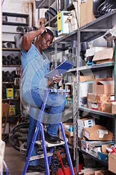 Worker taking inventory in store