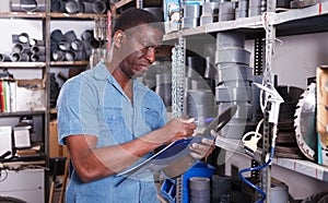 Worker taking inventory in store