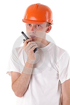 Worker talking on portable UHF radio transceiver